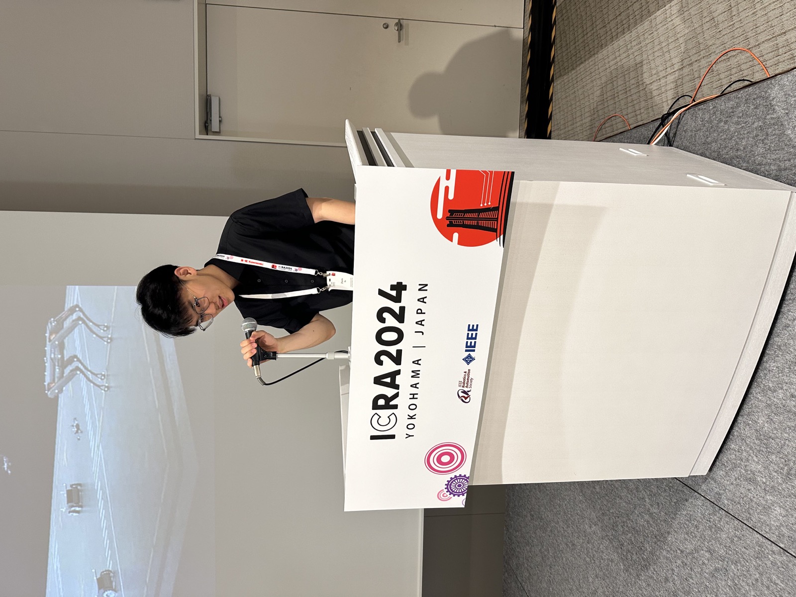 Zhuxiu Xu speaking at ICRA 2024